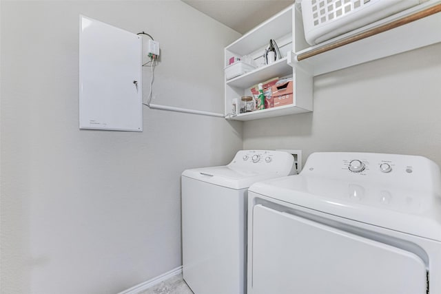 laundry area featuring baseboards, laundry area, and independent washer and dryer