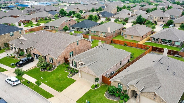 birds eye view of property with a residential view