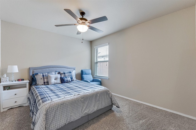 bedroom with baseboards, a ceiling fan, and carpet flooring