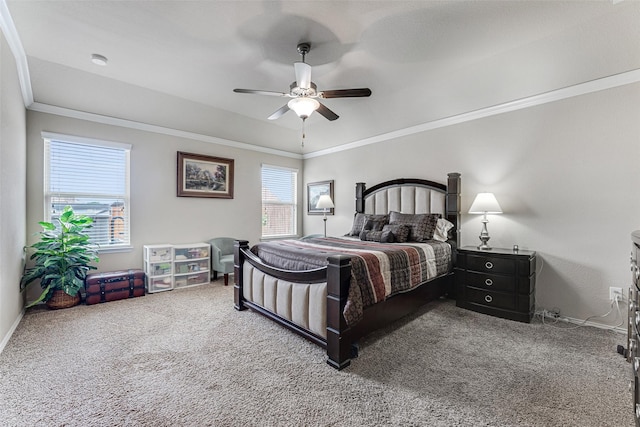carpeted bedroom with crown molding, baseboards, and a ceiling fan