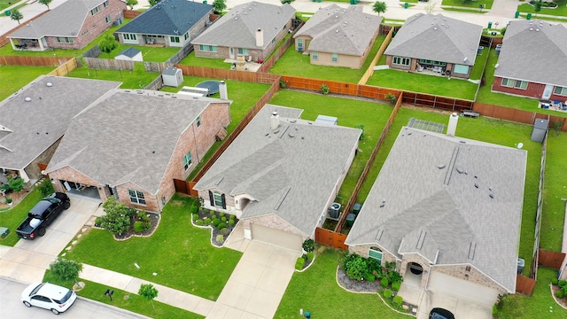 birds eye view of property with a residential view