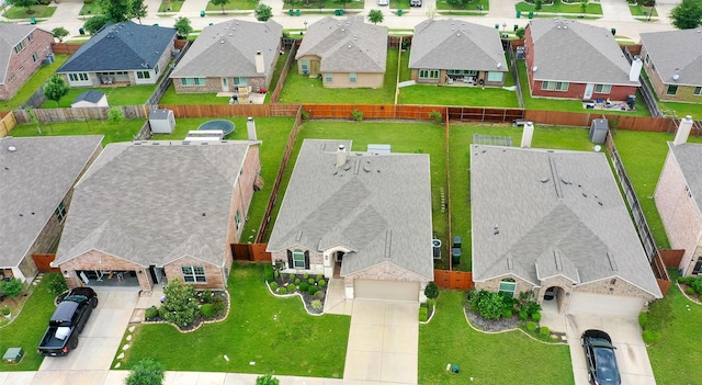 birds eye view of property with a residential view