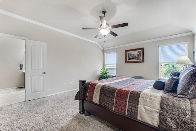 carpeted bedroom featuring crown molding, a ceiling fan, and baseboards