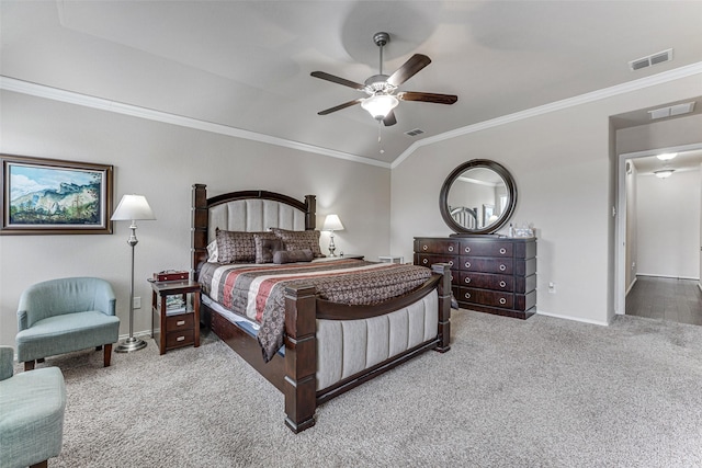 carpeted bedroom with crown molding, baseboards, and visible vents