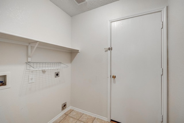 washroom featuring laundry area, hookup for a washing machine, electric dryer hookup, baseboards, and visible vents