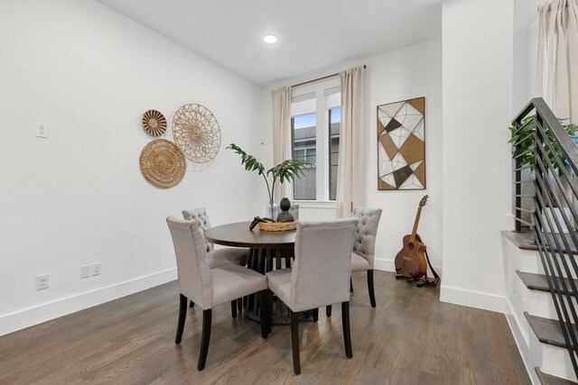 dining room with baseboards, recessed lighting, and wood finished floors