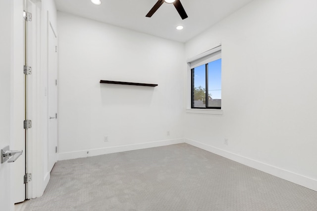 empty room featuring a ceiling fan, baseboards, recessed lighting, and light carpet
