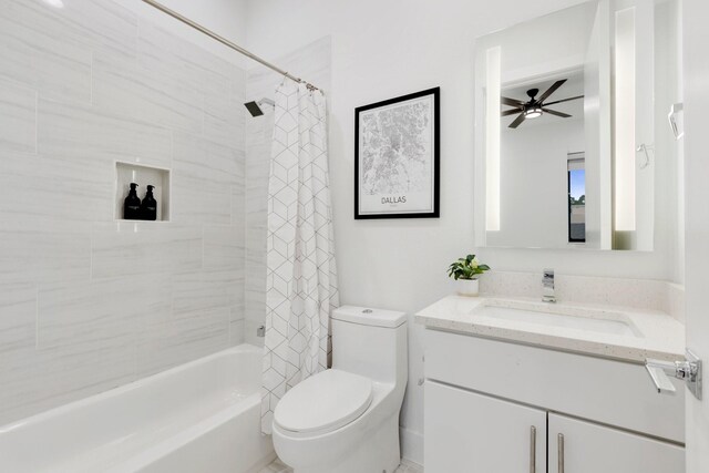 bathroom featuring vanity, a ceiling fan, shower / bathtub combination with curtain, and toilet