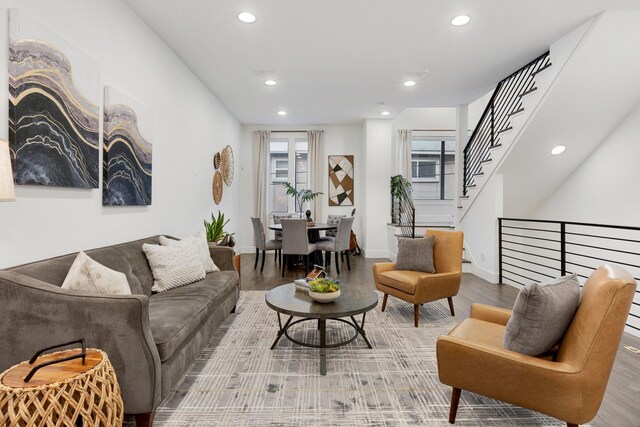 living area featuring recessed lighting, stairs, and wood finished floors
