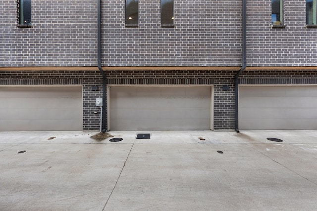 garage featuring driveway