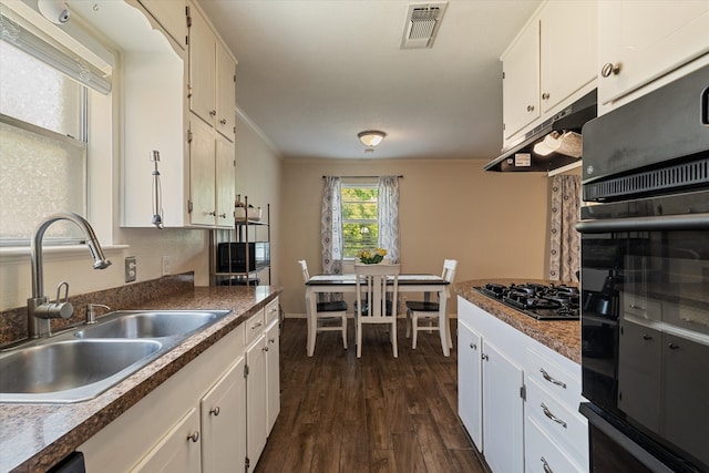kitchen with black appliances, a sink, under cabinet range hood, white cabinets, and dark wood-style floors