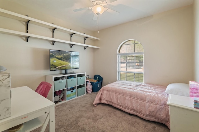 bedroom featuring light carpet, baseboards, and a ceiling fan