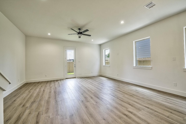 empty room featuring visible vents, baseboards, recessed lighting, a ceiling fan, and light wood-style flooring
