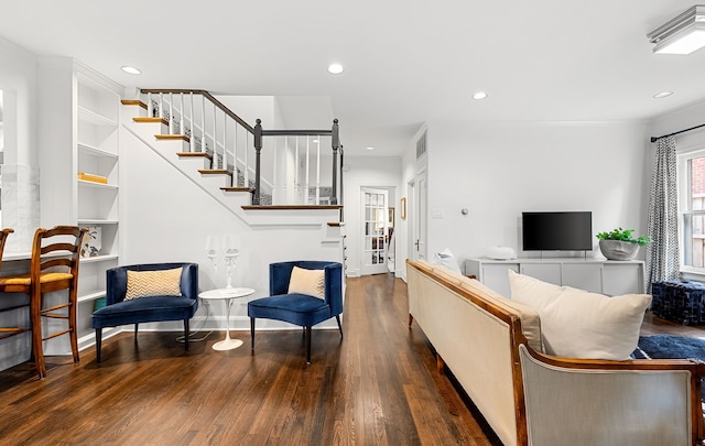 living room featuring stairs, recessed lighting, visible vents, and wood finished floors