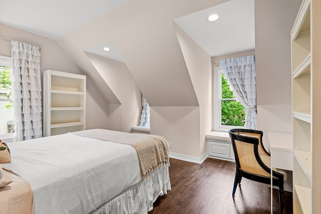 bedroom featuring dark wood-type flooring, recessed lighting, lofted ceiling, and multiple windows
