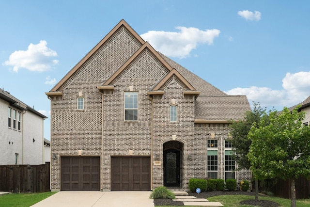 6625 Titus Ln, Frisco, TX 75036 - view of front facade with fence, roof with shingles, brick siding, an attached garage, and driveway