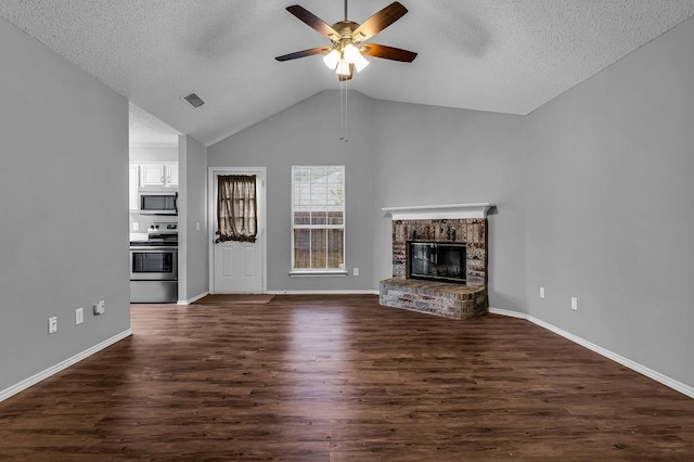 unfurnished living room featuring visible vents, a ceiling fan, a textured ceiling, and lofted ceiling