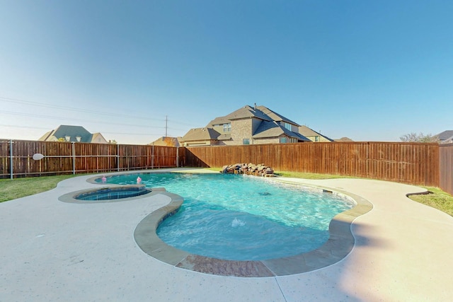 view of swimming pool with a patio, a fenced backyard, and a pool with connected hot tub