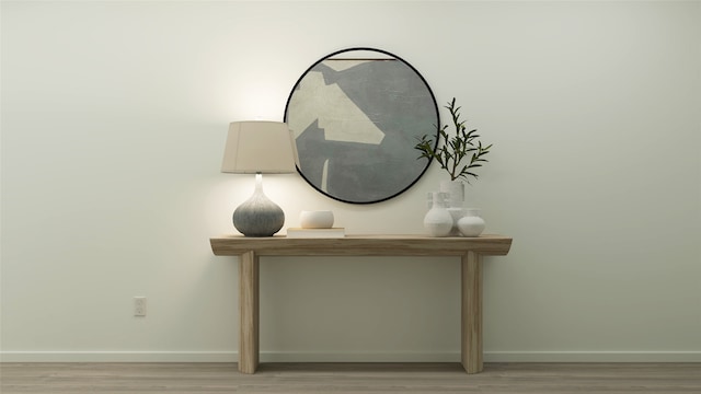 room details featuring baseboards and wood finished floors