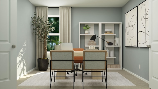 carpeted dining room with baseboards