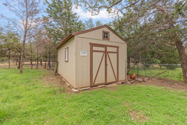 view of shed with fence