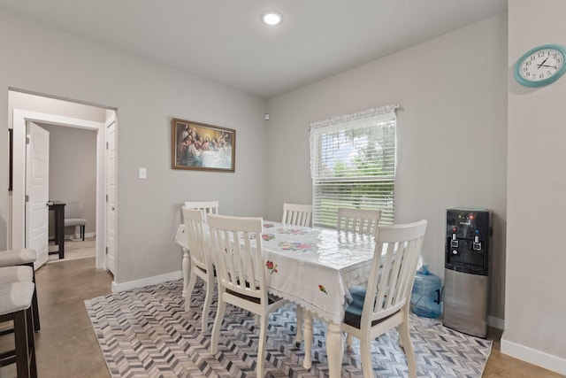 dining room with recessed lighting and baseboards