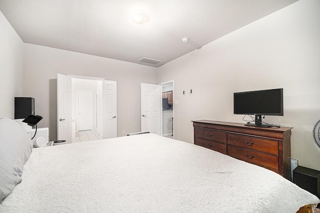 bedroom featuring visible vents