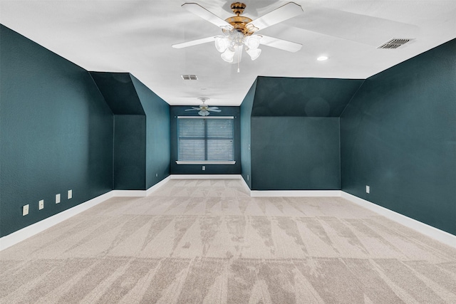 additional living space featuring visible vents, carpet flooring, baseboards, and a ceiling fan