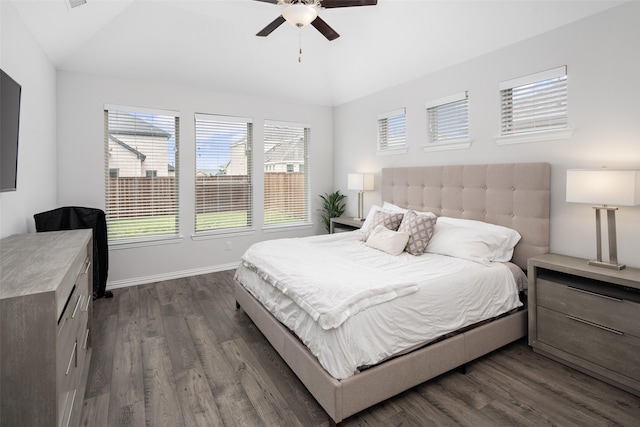 bedroom with baseboards, dark wood-style flooring, ceiling fan, and lofted ceiling