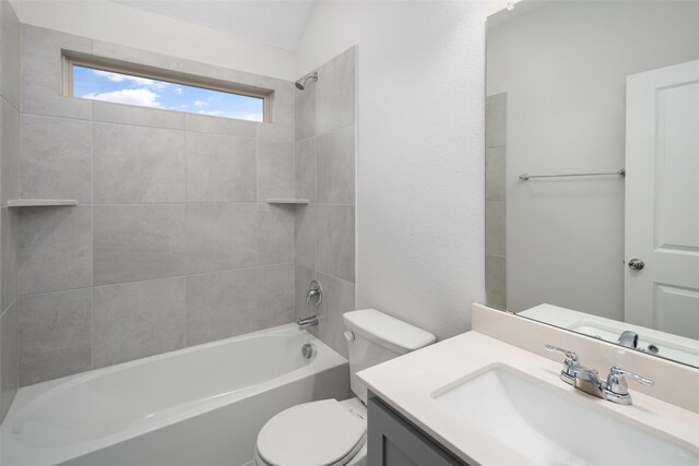 bathroom featuring toilet,  shower combination, and vanity