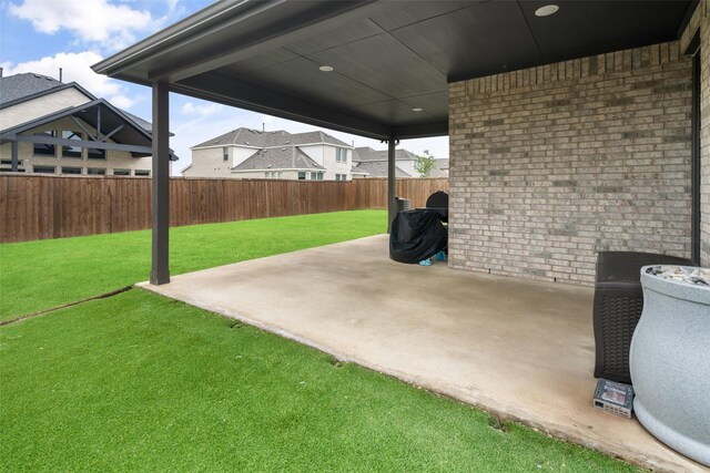 carpeted living area with baseboards, a ceiling fan, and visible vents