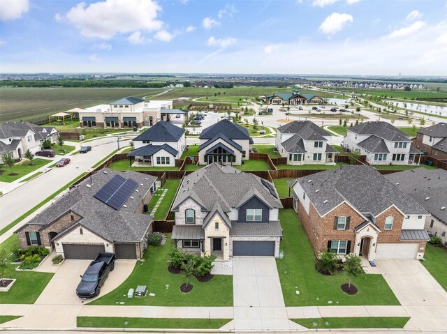 aerial view with a water view and a residential view