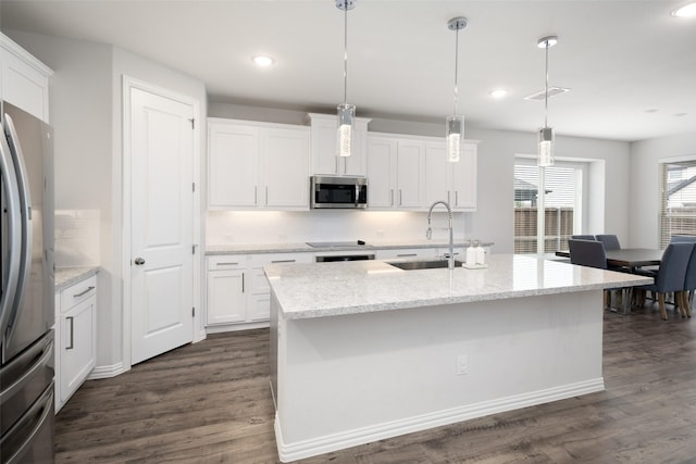 kitchen featuring stainless steel appliances, recessed lighting, dark wood-style floors, and a sink