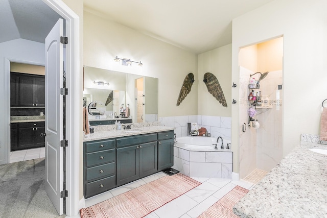 126 Esther Ct, Millsap, TX 76066 - bathroom featuring lofted ceiling, tiled shower, a garden tub, and vanity