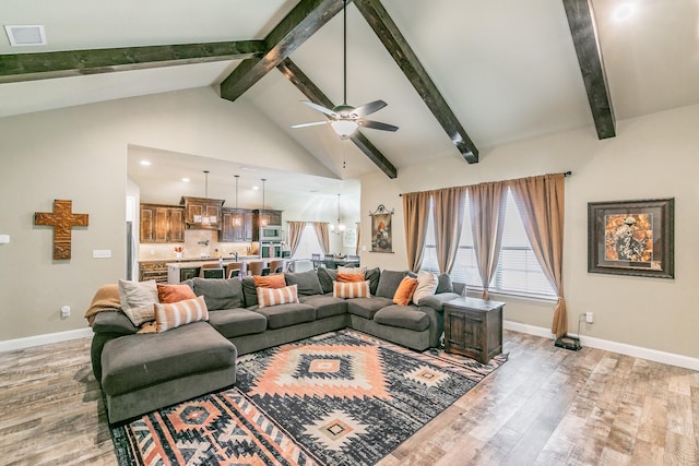 126 Esther Ct, Millsap, TX 76066 - living area featuring baseboards, visible vents, beam ceiling, and light wood-type flooring
