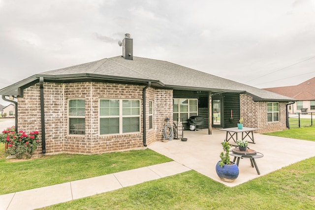 126 Esther Ct, Millsap, TX 76066 - rear view of property featuring brick siding, a lawn, a chimney, and a patio