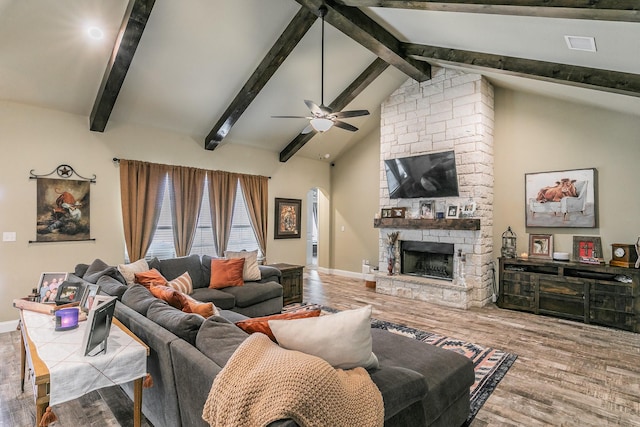 126 Esther Ct, Millsap, TX 76066 - living room with vaulted ceiling with beams, a ceiling fan, wood finished floors, and a fireplace