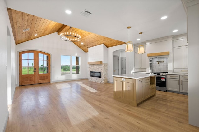 1900 County Road 1255, Savoy, TX 75479 - kitchen featuring electric range, visible vents, decorative backsplash, and a chandelier