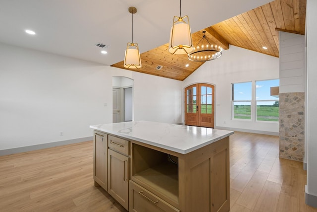 1900 County Road 1255, Savoy, TX 75479 - kitchen with visible vents, a center island, arched walkways, open floor plan, and light wood-style floors