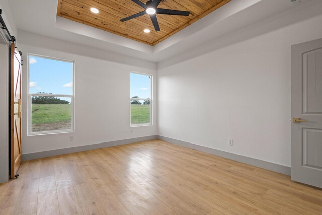 1900 County Road 1255, Savoy, TX 75479 - unfurnished room featuring a tray ceiling, ceiling fan, wood ceiling, and light wood-style floors