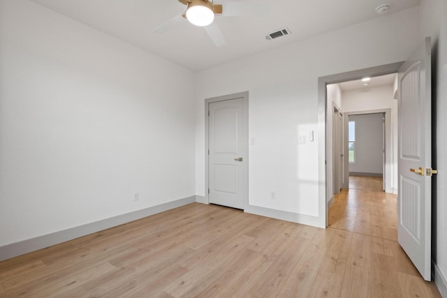 1900 County Road 1255, Savoy, TX 75479 - unfurnished bedroom featuring ceiling fan, baseboards, visible vents, and light wood-style flooring