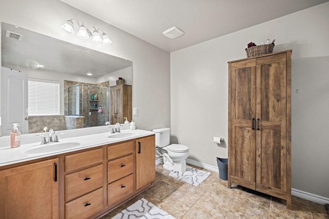 6336 Maritime St, Fort Worth, TX 76179 - full bathroom with a stall shower, toilet, double vanity, and baseboards