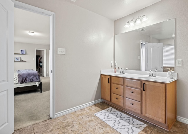 6336 Maritime St, Fort Worth, TX 76179 - full bath with baseboards, double vanity, a textured wall, and tile patterned floors
