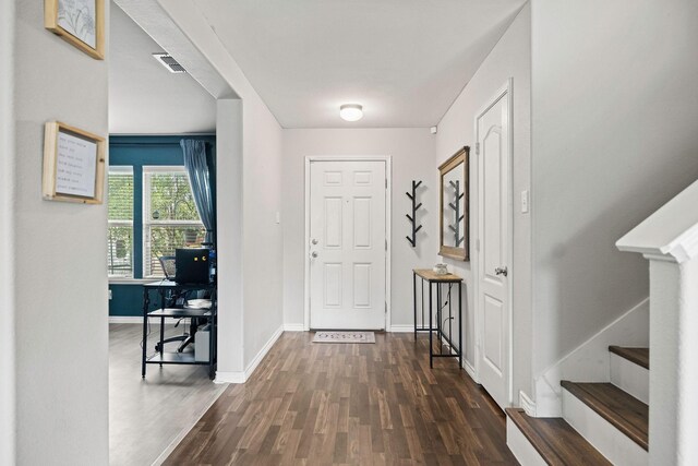 6336 Maritime St, Fort Worth, TX 76179 - foyer entrance featuring dark wood finished floors, baseboards, and stairs