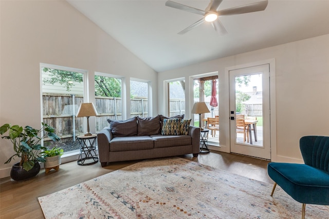 living room featuring high vaulted ceiling, ceiling fan, and wood finished floors