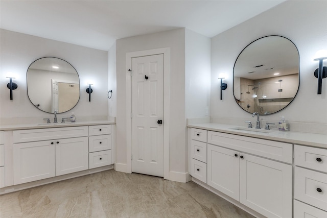 bathroom with a sink, two vanities, a shower stall, and marble finish floor