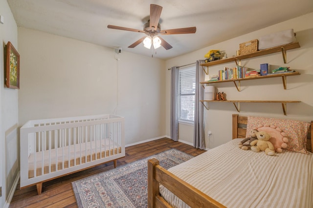 bedroom with baseboards, ceiling fan, and wood finished floors
