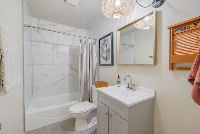 bathroom with toilet, shower / bath combo, and vanity