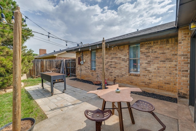view of patio / terrace featuring fence