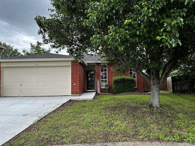 view of front of house with fence, an attached garage, brick siding, concrete driveway, and a front lawn